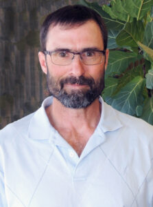 Photo of Russ Duke- dark-haired man